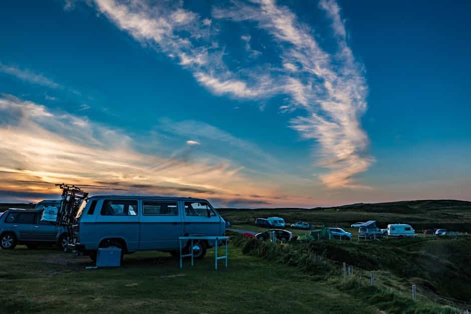 Campers and vans at sunset
