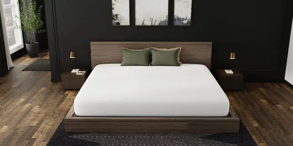 Alaskan King bed mattress on wooden platform in modern dark bedroom