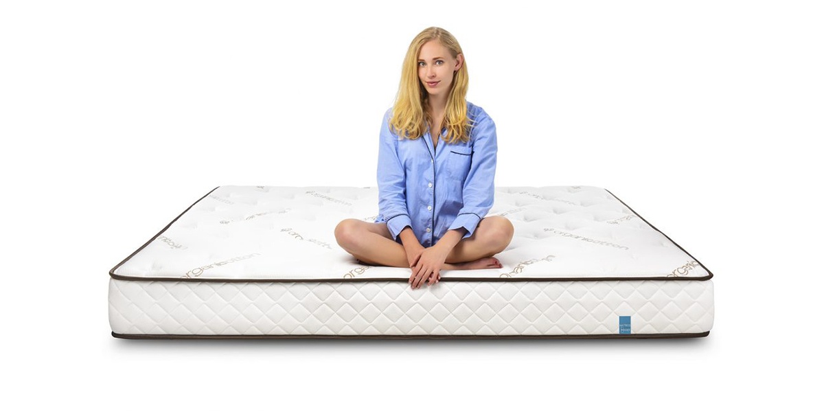 Woman sitting on latex mattress product