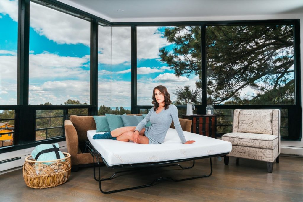 Woman on deluxe sofa mattress modern room
