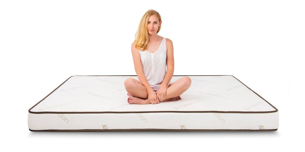 Woman sitting on Elation RV mattress