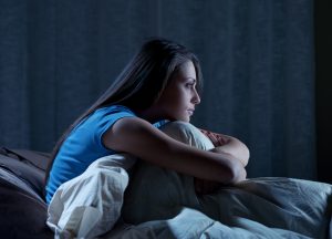 Woman with insomnia awake at night