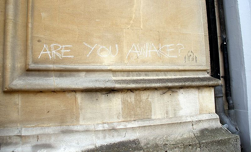 Are you awake wall graffiti sign
