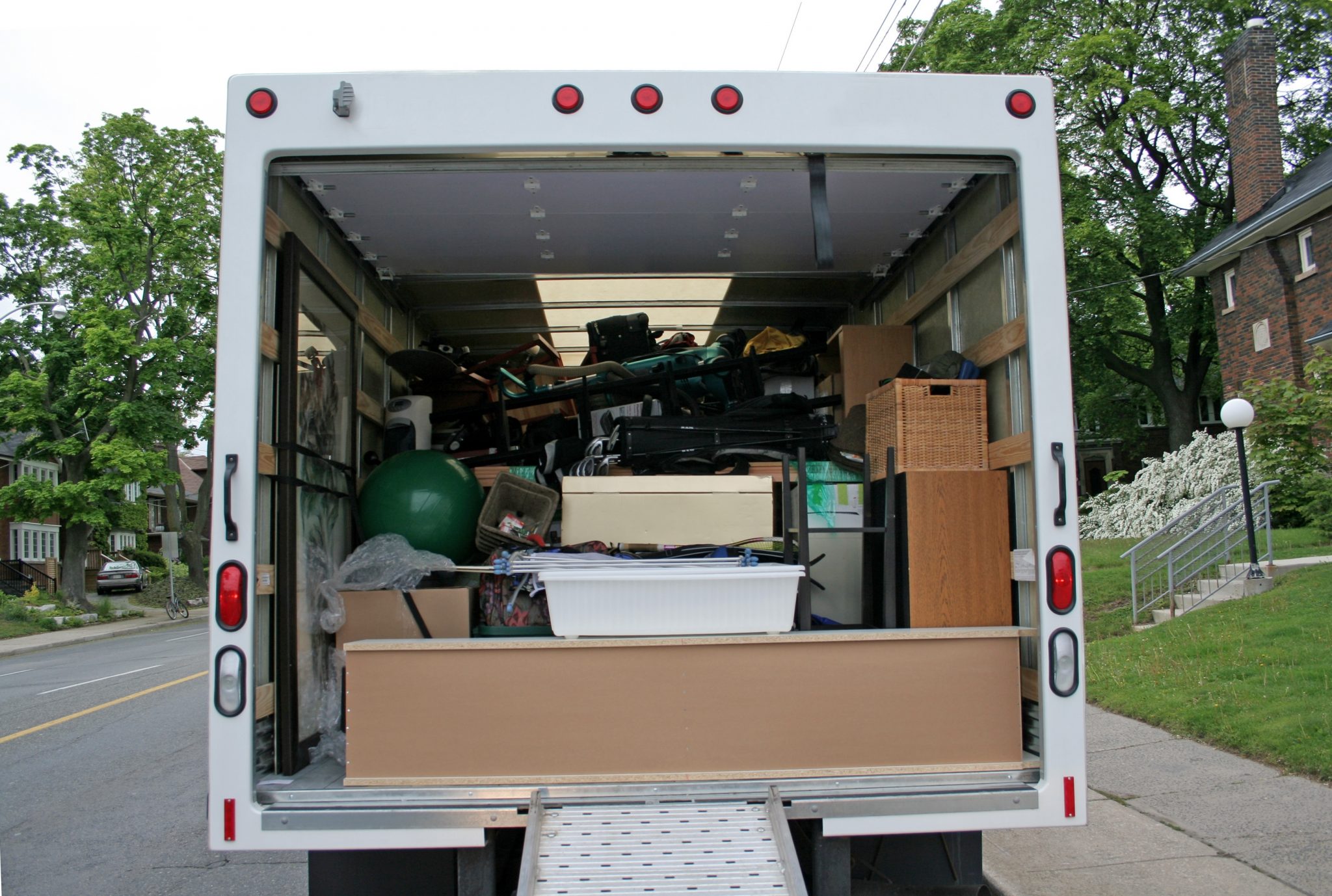 Moving truck packed with mattress foam and household items